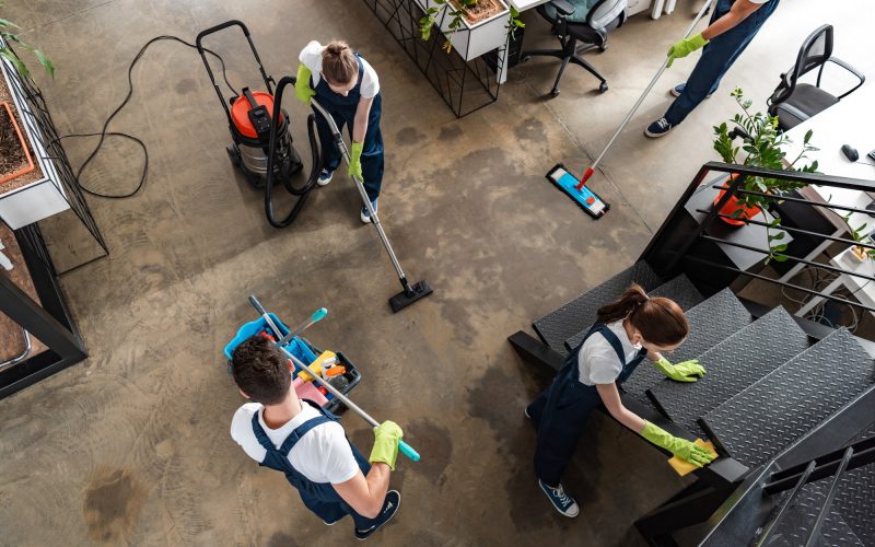 top view of cleaning company team cleaning modern office